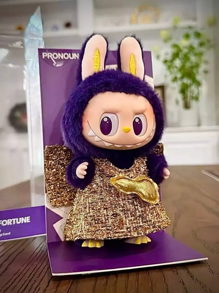 Labubu Wings of Fortune hanging card on table in living room