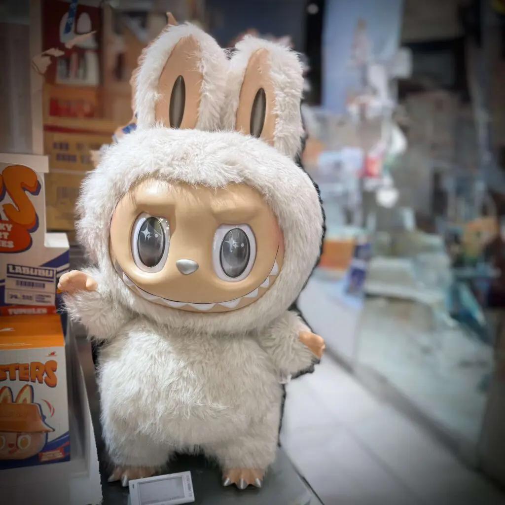 Labubu Zimomo Angel in Clouds on display stand at Pop Mart store in Costa Mesa, California