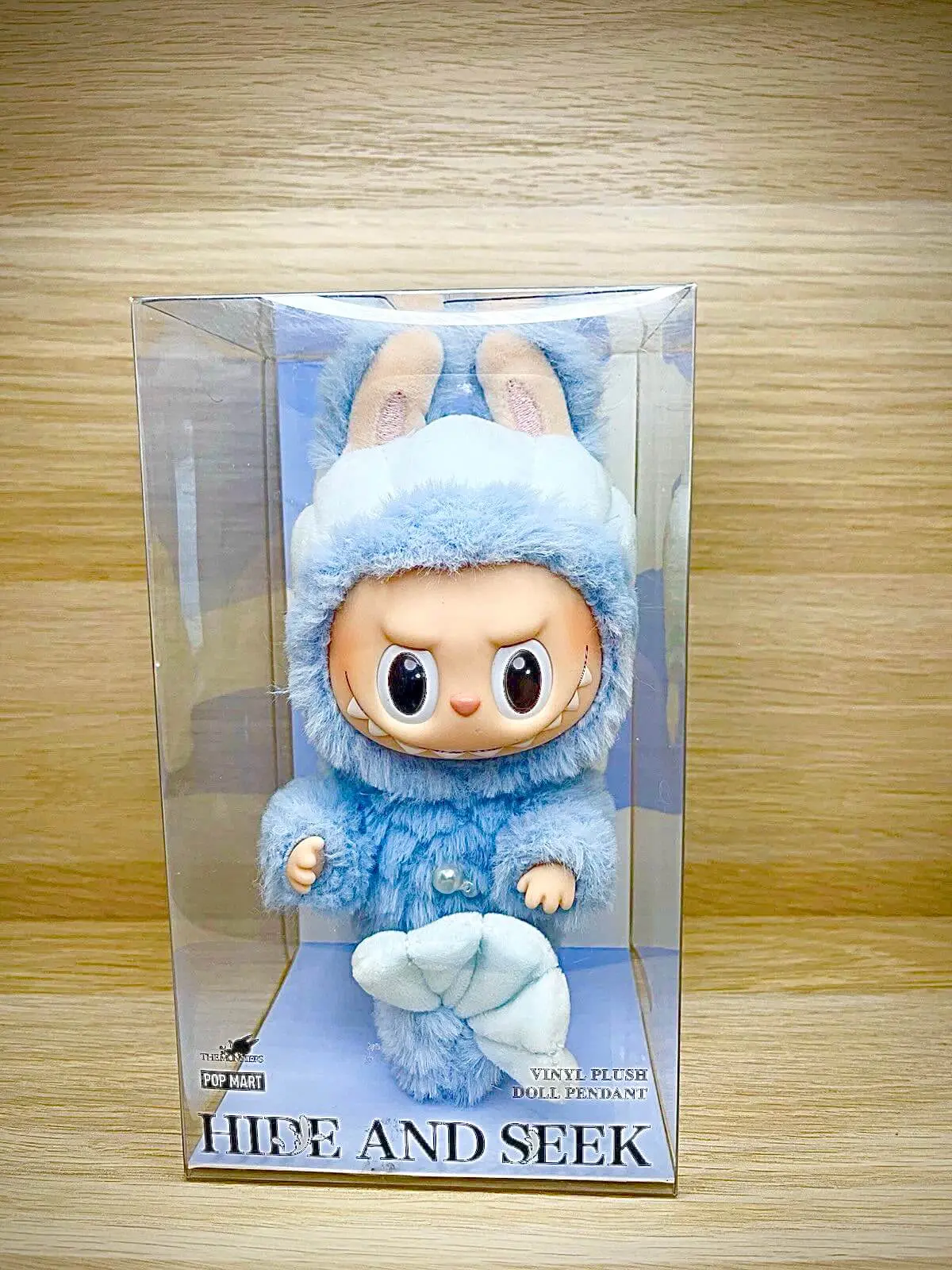 Labubu Hide and Seek (Singapore only) on a wooden shelf