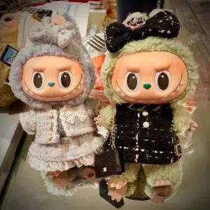 Labubu dolls Sesame Bean and Green Grape from Exciting Macaron series dressed in outfits