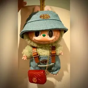 Labubu doll called Green Grape dressed in blue overalls (Exciting Macaron series)