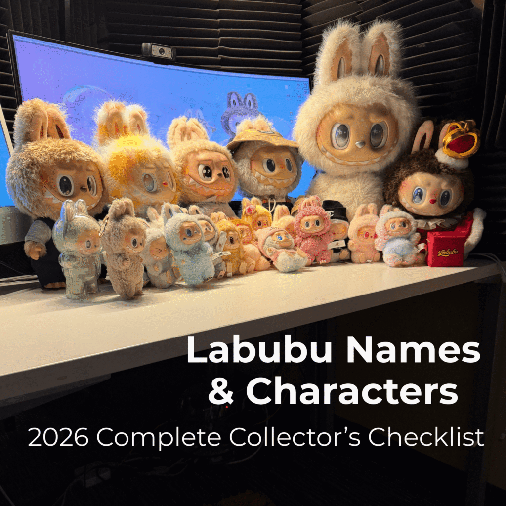 Original group photo of a Labubu collection for the 2026 Labubu names and character, dolls checklist guide, featuring Zimomo Angel in Clouds, Fall in Wild plush, and a variety of keychain dolls on a desk in front of computer