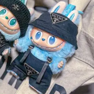 Labubu doll called Hope dressed in dark blue Prada overalls (Big Into Energy series)