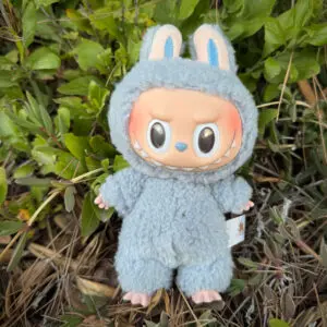 Labubu Sea Salt Coconut standing in nature in front of forest