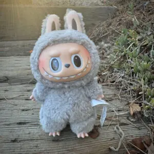 Labubu Sesame Bean standing on wooden walkway outside