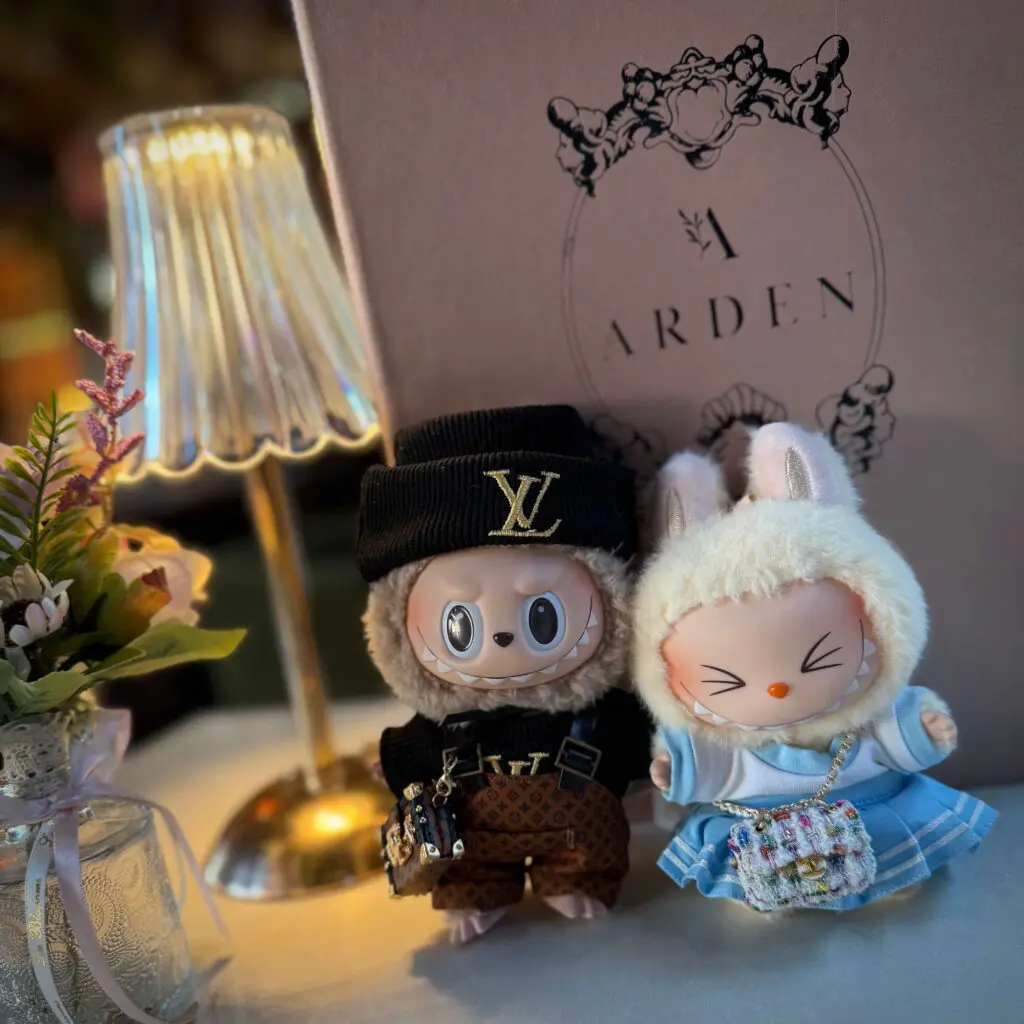 The Labubu dolls Toffee and Sisi all dressed up and at a fancy restaurant for our anniversary dinner