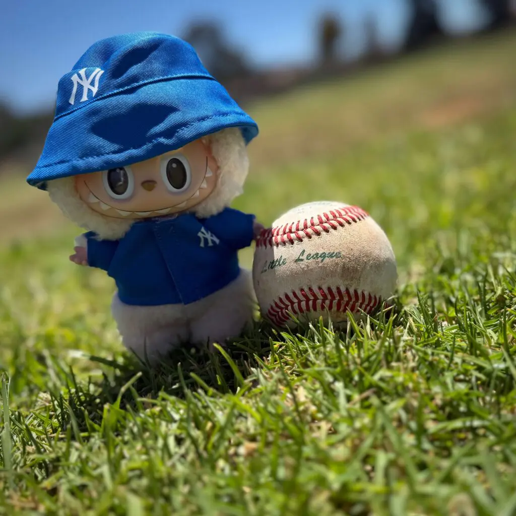 Labubu Soymilk doll from the Exciting Macaron in Yankees sun hat and jersey