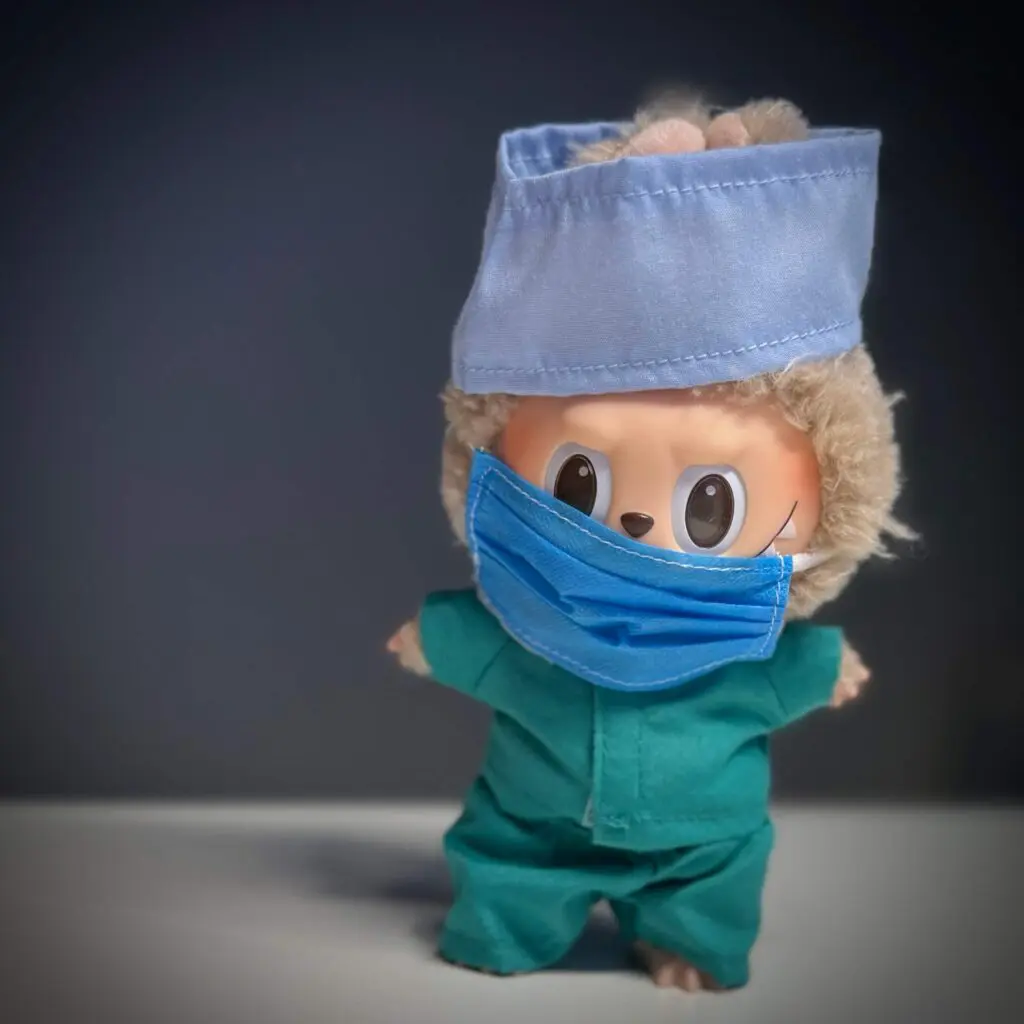 Labubu doll named toffee dressed in doctor's outfit with spotlight shine on it