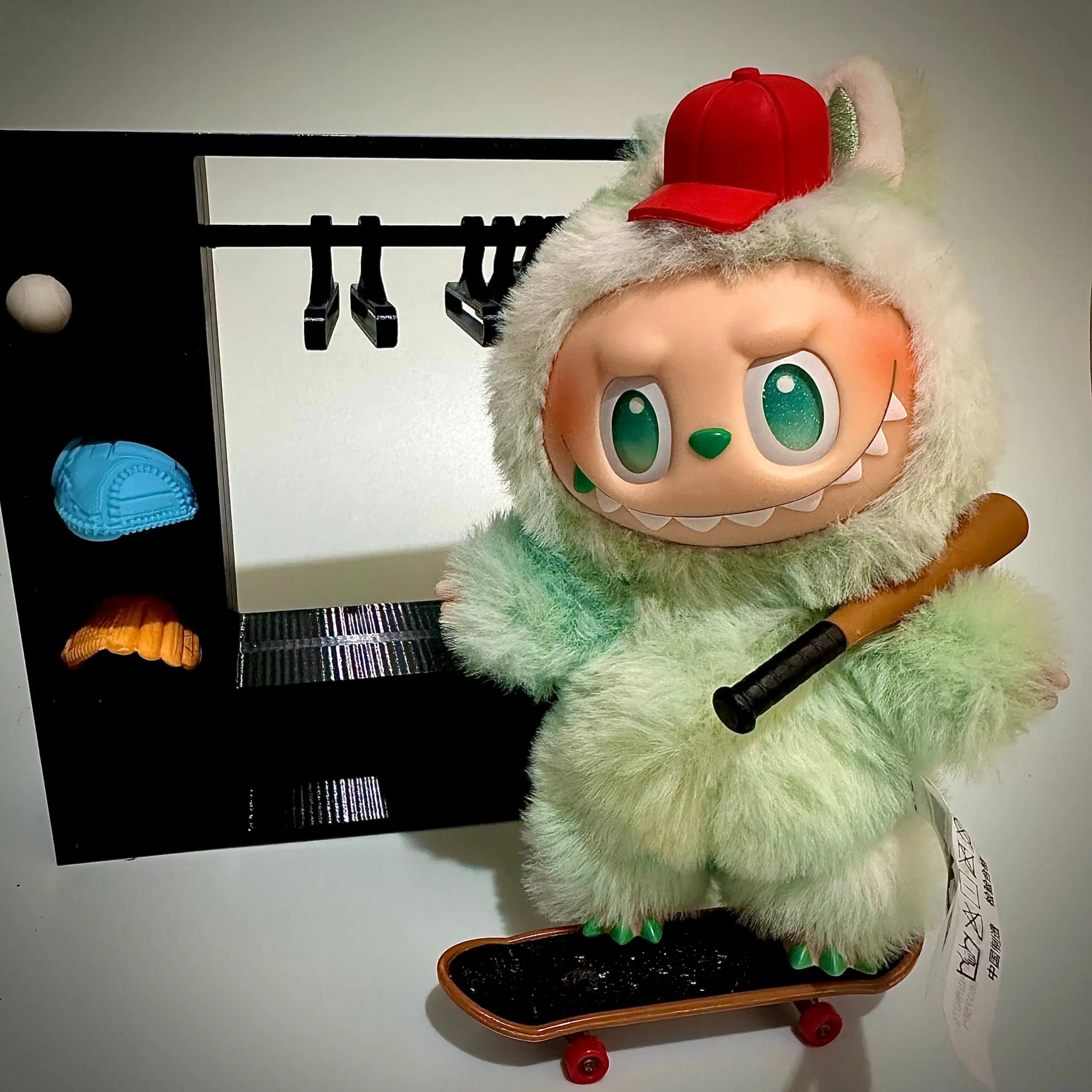 Labubu Serenity Hat and baseball bat in front of wardrobe