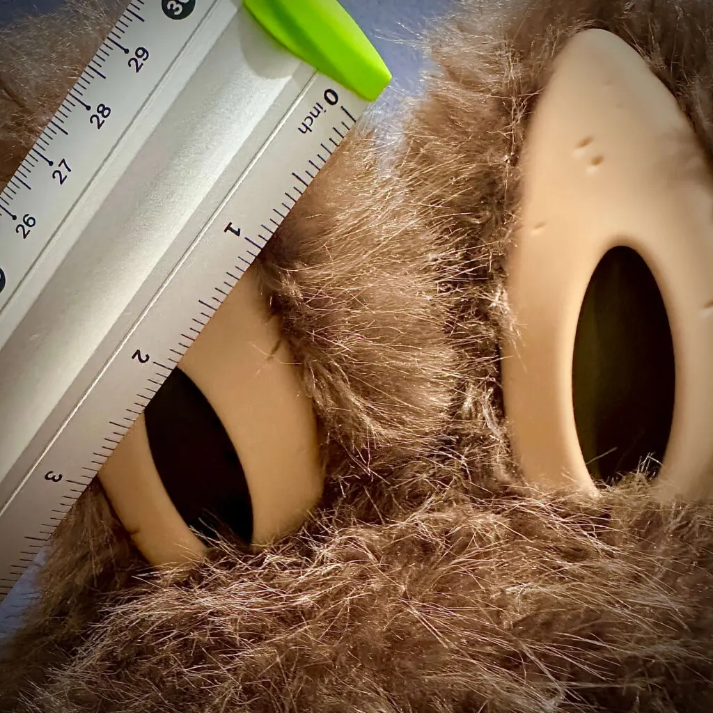 Ruler measuring the size of the ears of Zimomo I Found You doll