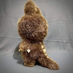 Side view showing table of large Labubu plush doll Zimomo