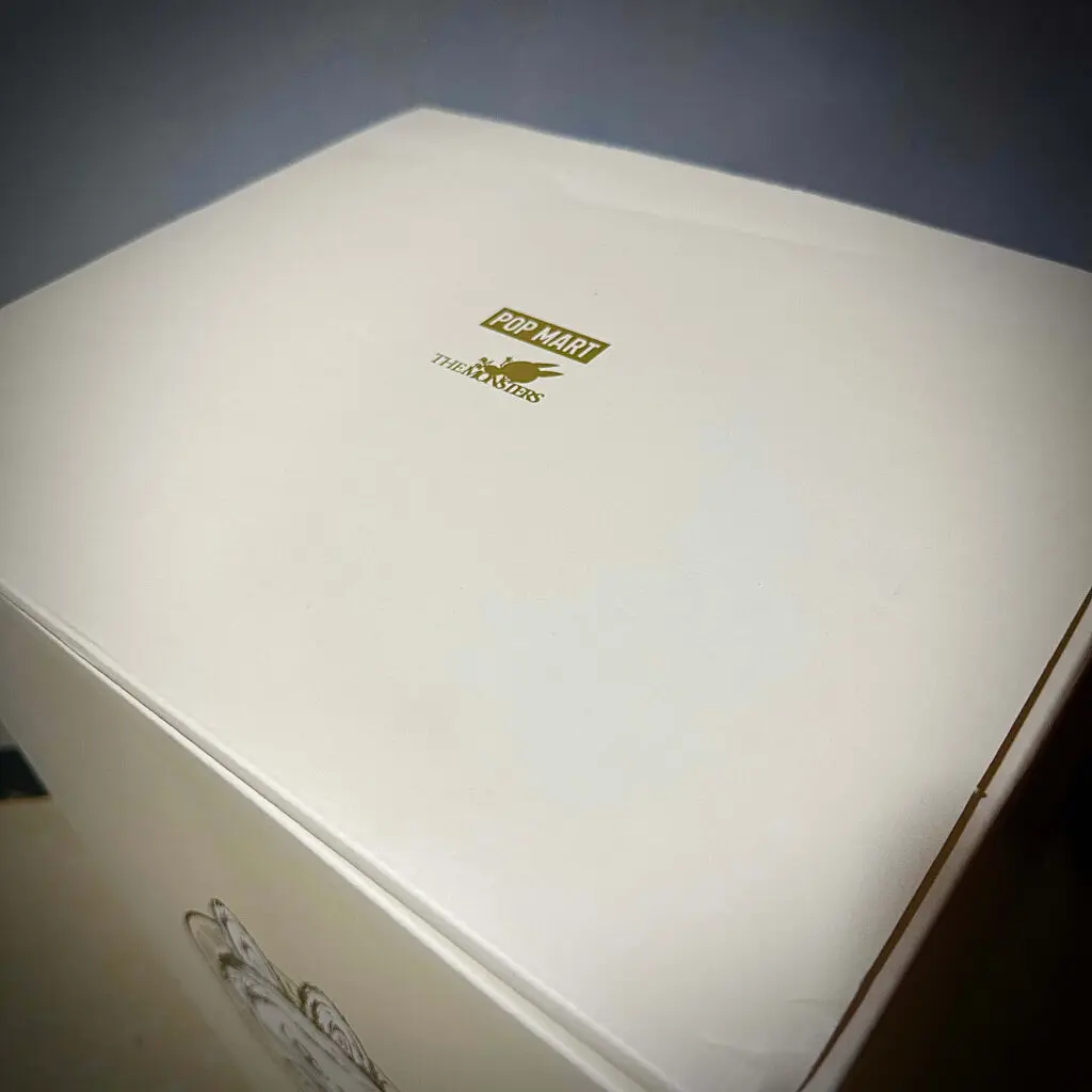 Close up of top of Zimomo Labubu I Found You box showing Monsters logo