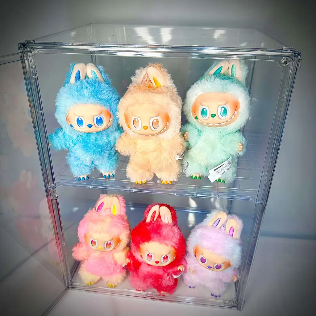 6 Labubu Big Into Energy dolls inside an acrylic display case that has 2 rows