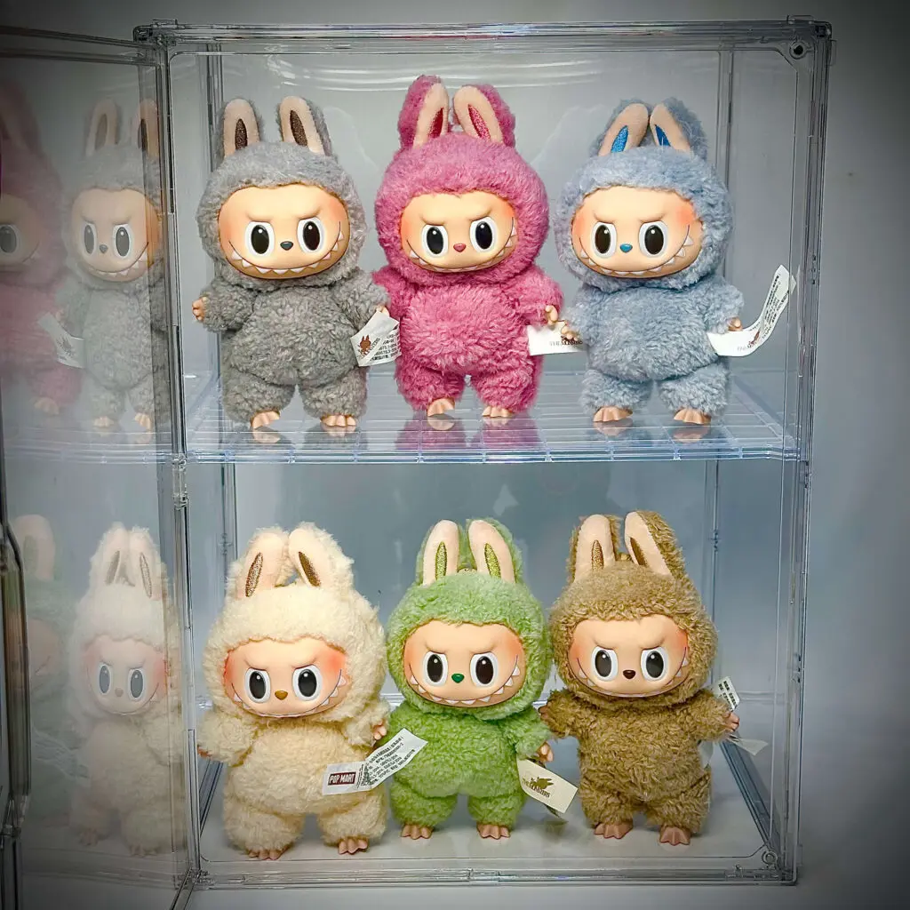 6 Labubu Exciting Macaron dolls inside an acrylic display case that has 2 rows