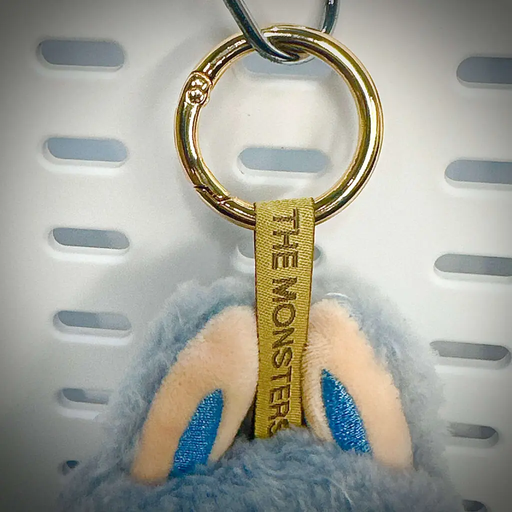 Labubu doll Sea Salt Coconut close-up: The Monsters engraving on lanyard (Exciting Macaron series)