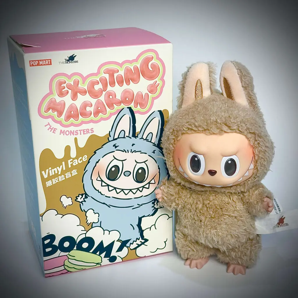 Labubu Toffee next to an opened Exciting Macaron blind box