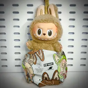 Labubu Toffee doll from the Exciting Macaron series inside its foil pouch