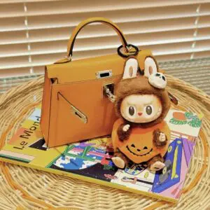 labubu halloween sitting pumpkin in brown bag