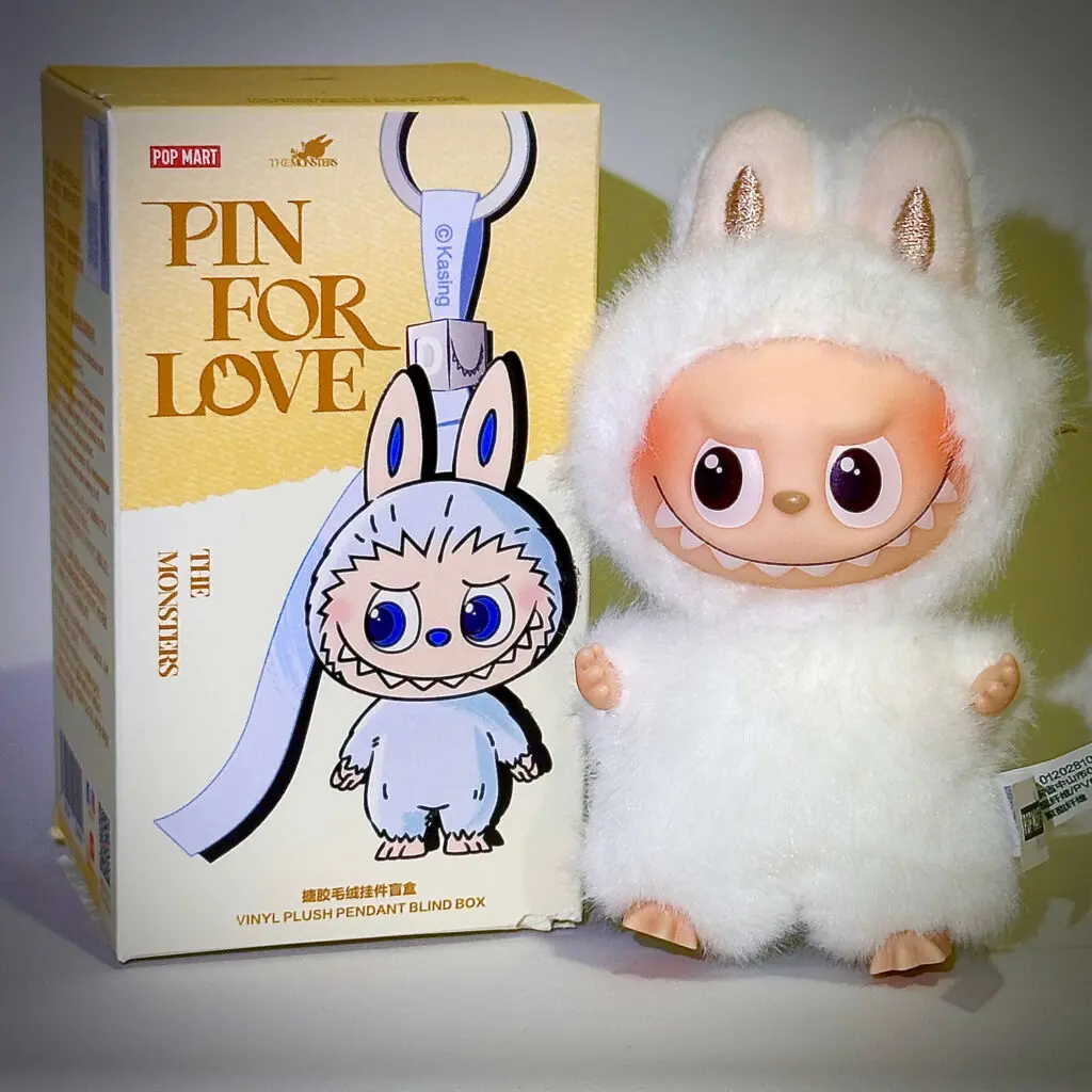 mini labubu pin for love H beside box