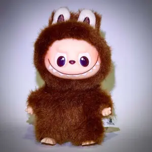 Labubu Pin for Love L Love standing in spotlight in white background with vignette