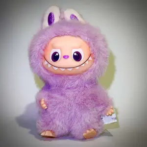 Labubu Pin for Love M Movitation in spotlight and white background