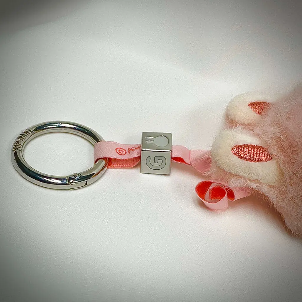 Labubu doll "G" close-up: Lanyard and nuggest attached to the doll (Pin for Love series)