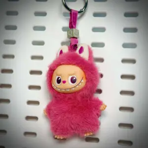 Labubu Pin for Love Q Quiet hanging on a board