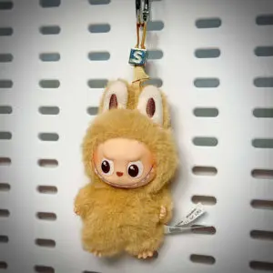 Labubu Pin for Love S Smile hanging on a board