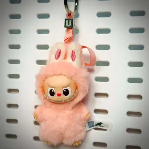 Labubu Pin for Love U Unity hanging on a board