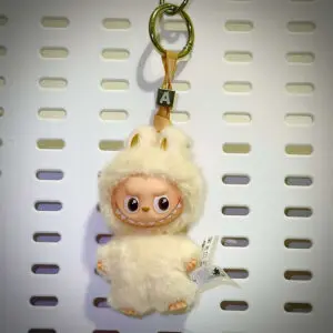 Labubu Pin for Love A Adventure hanging on a board