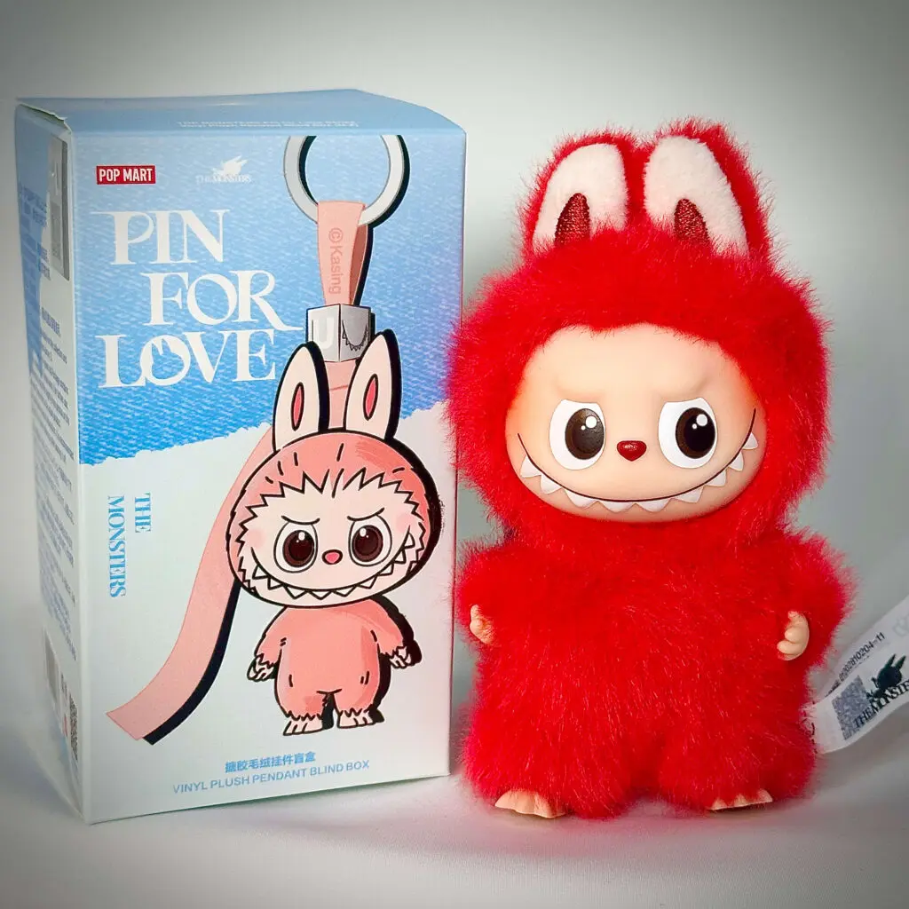 mini labubu pin for love x beside box