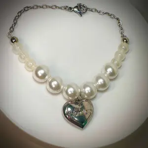 rock the universe labubu necklace under spotlight