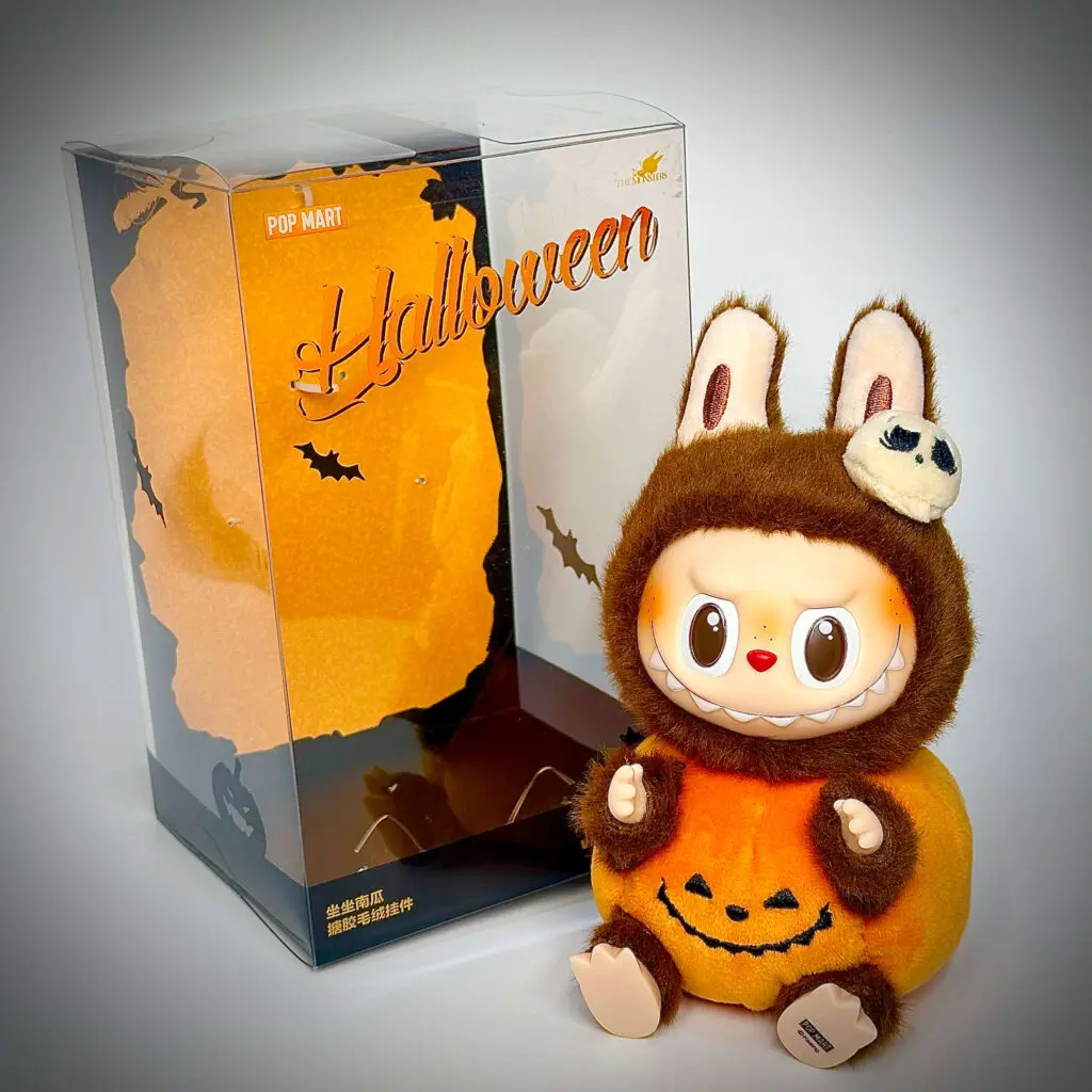 labubu halloween pumpkin beside plastic box