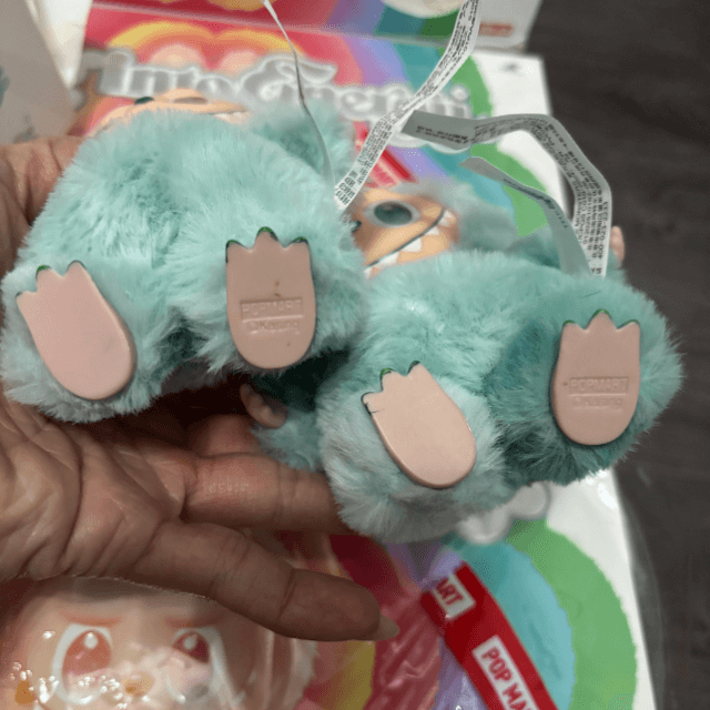 Close up for fake Labubu doll Serenity with feet that has sloppy nail polish