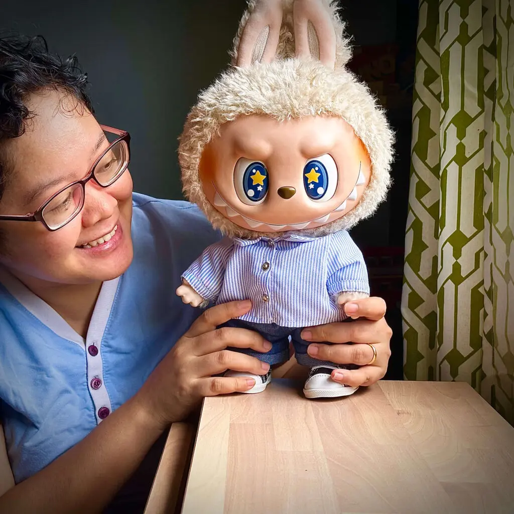 With one of our favorite Labubu dolls, Flip with Me on wardrobe next to window.