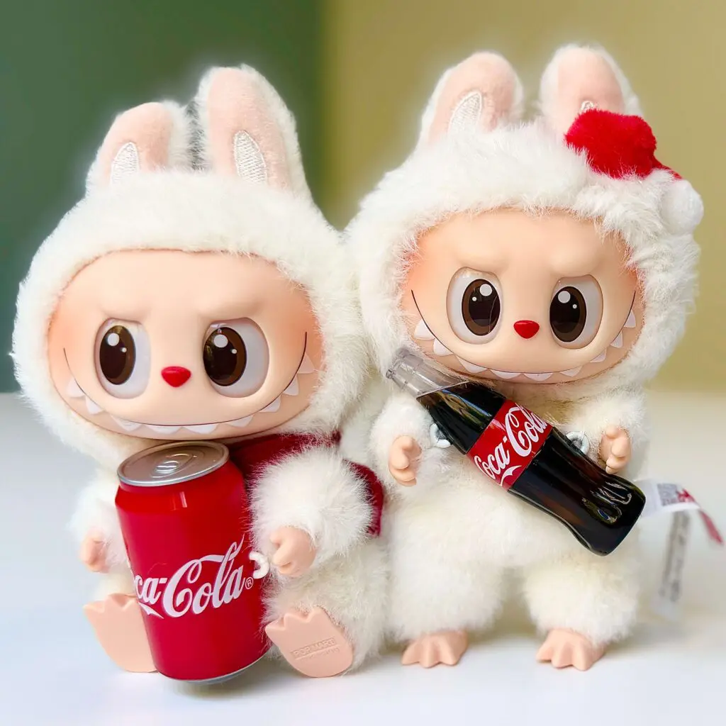Coca-Cola Labubu doll Happy Factor and Surprise Shake side by side
