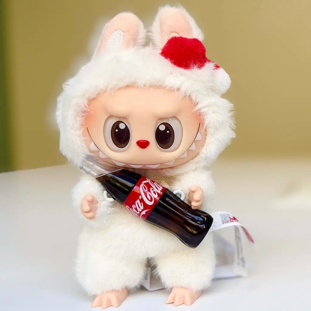 front view of Coca-Cola Labubu doll Surprise Shake