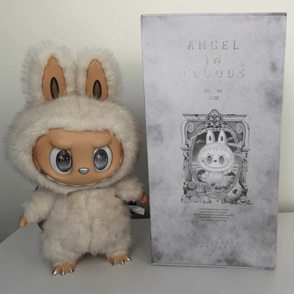Labubu Zimomo Angel In Clouds plush doll beside box packaging
