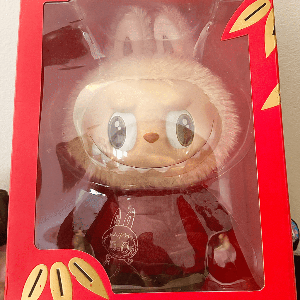 square crop of Labubu Best of Luck plush doll in original box packaging