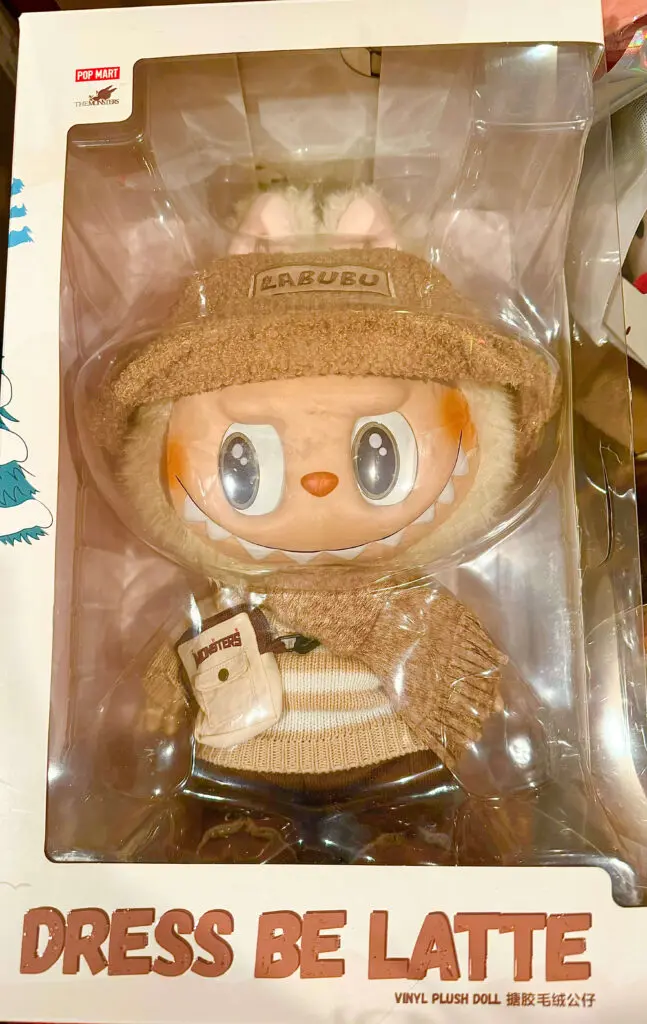 rectangular crop of Labubu Dress Be Latte plush doll in original box packaging