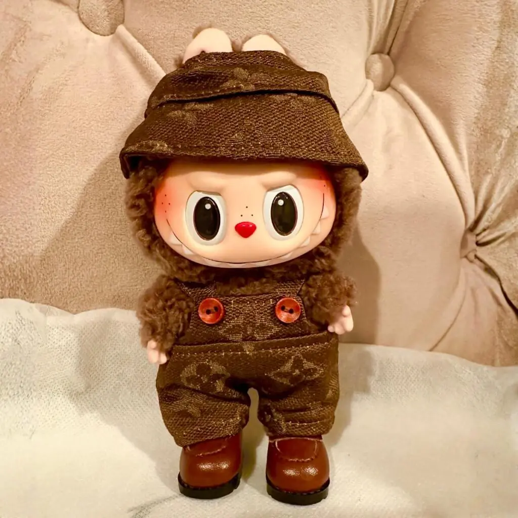 Labubu Exciting Macaron Series Secret character Chestnut Cocoa in a matching Louis Vuitton brown clothing