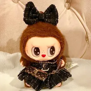 Labubu Have A Seat Series secret character Duo Duo dressed in matching black Louis Vuitton clothing and accessories