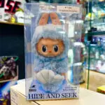 Labubu Hide and Seek Singapore-exclusive keychain doll on a store display inside box