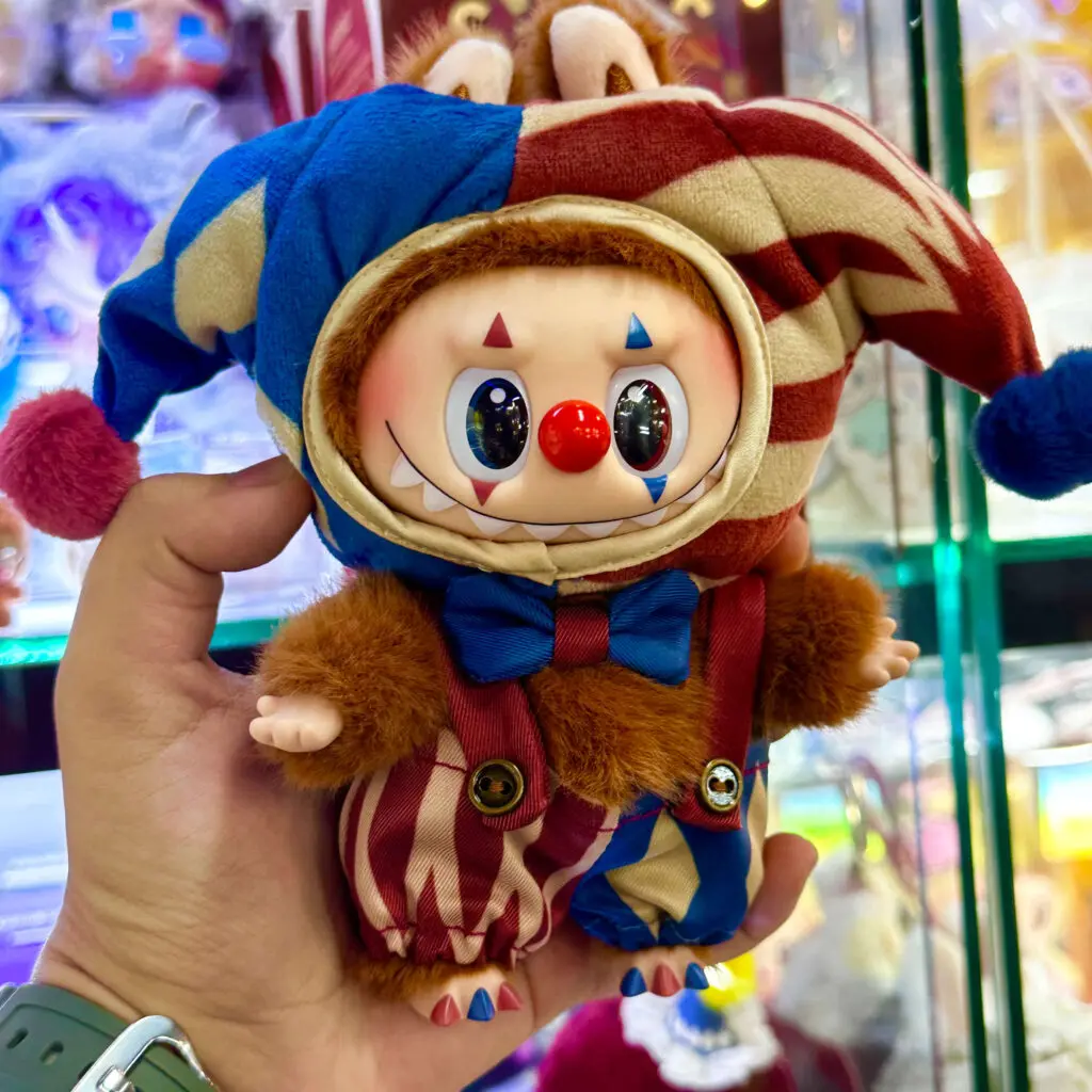 Pop Mart Why So Serious Series Labubu Juggling Clown keychain doll held in hand