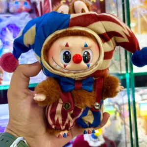 Pop Mart Why So Serious Series Labubu Juggling Clown keychain doll held in hand