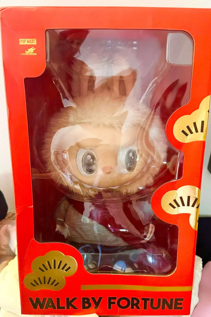 rectangular crop of Labubu Walk By Fortune plush doll in original box packaging