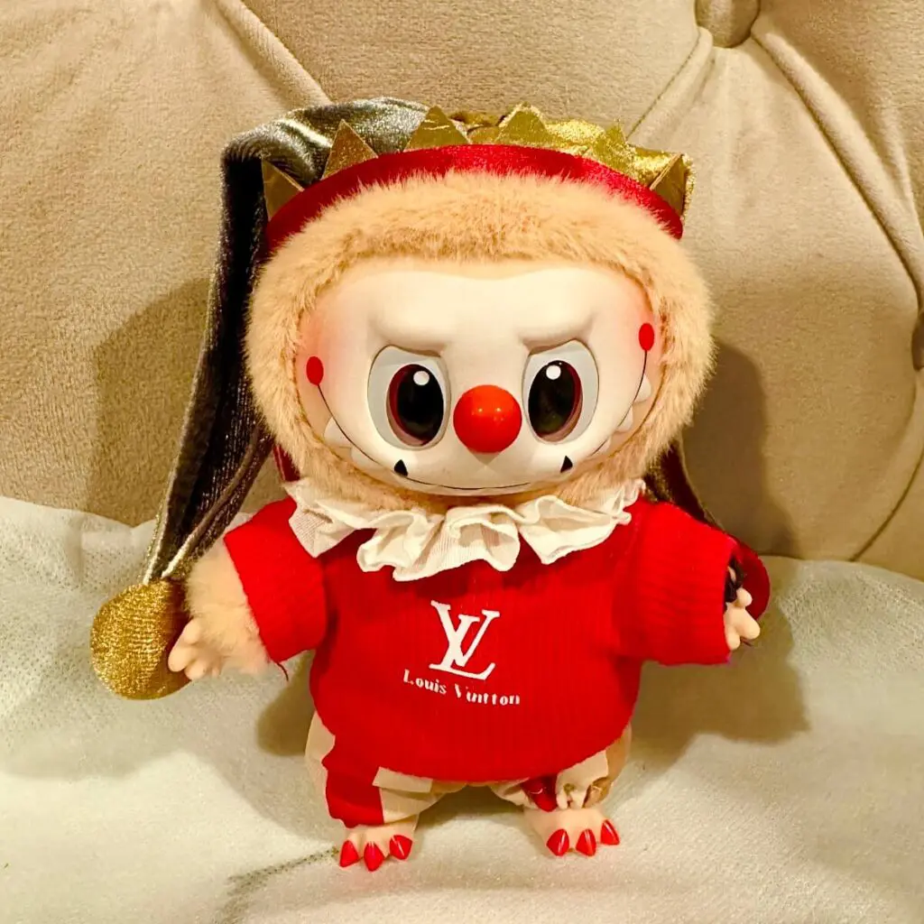 Labubu Why So Serious series super secret edition Moonlit Mask standing on a sofa