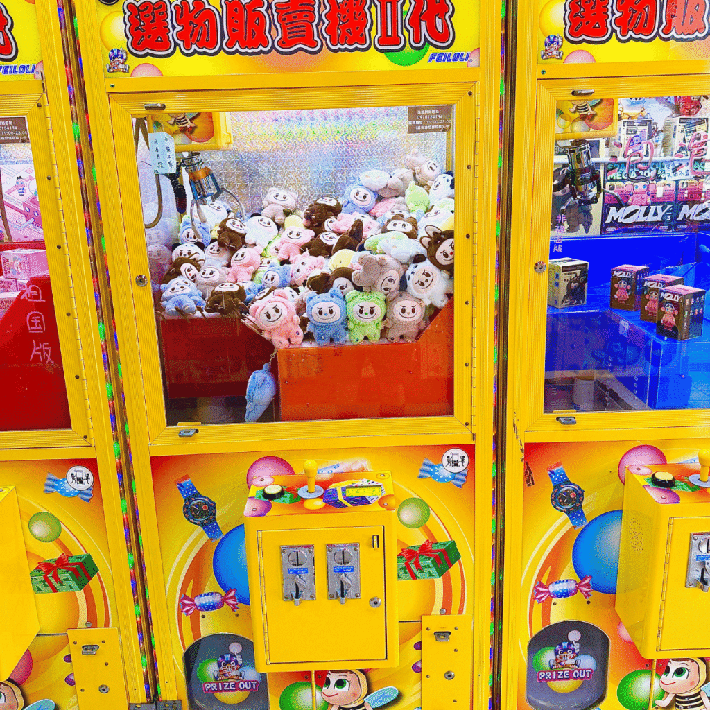 lafufu keychain dolls inside a yellow claw machine