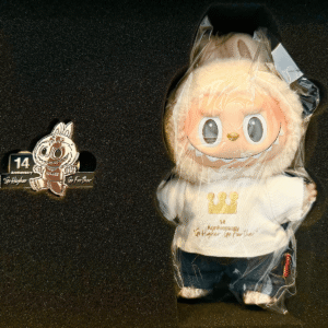square crop of Popmart 14th anniversary Labubu keychain doll with pin in original box packaging