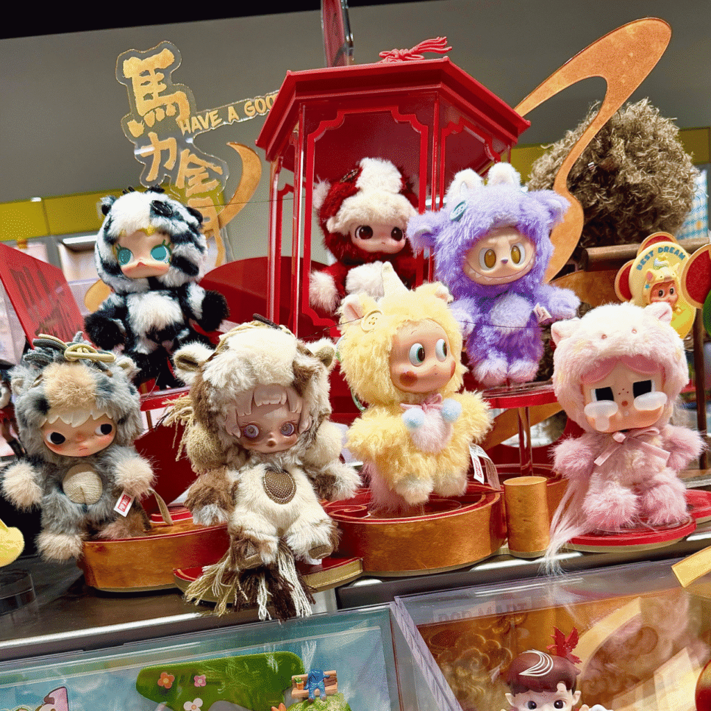 complete set of Have A Good Run Series keychain dolls on a display shelf in Pop Mart